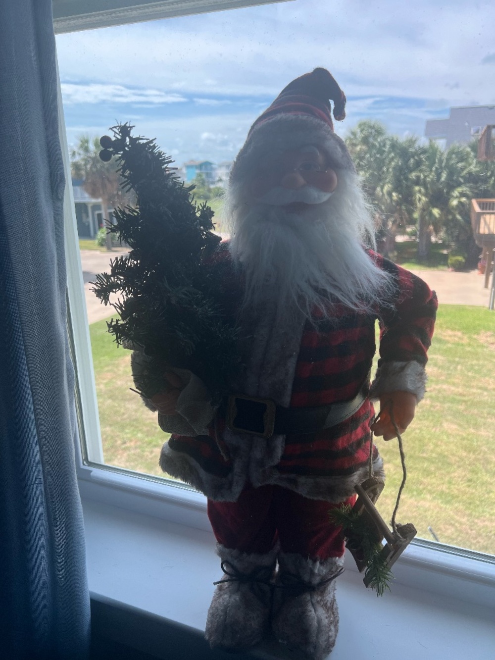 26 inch Santa Clause holding sleigh & tree
